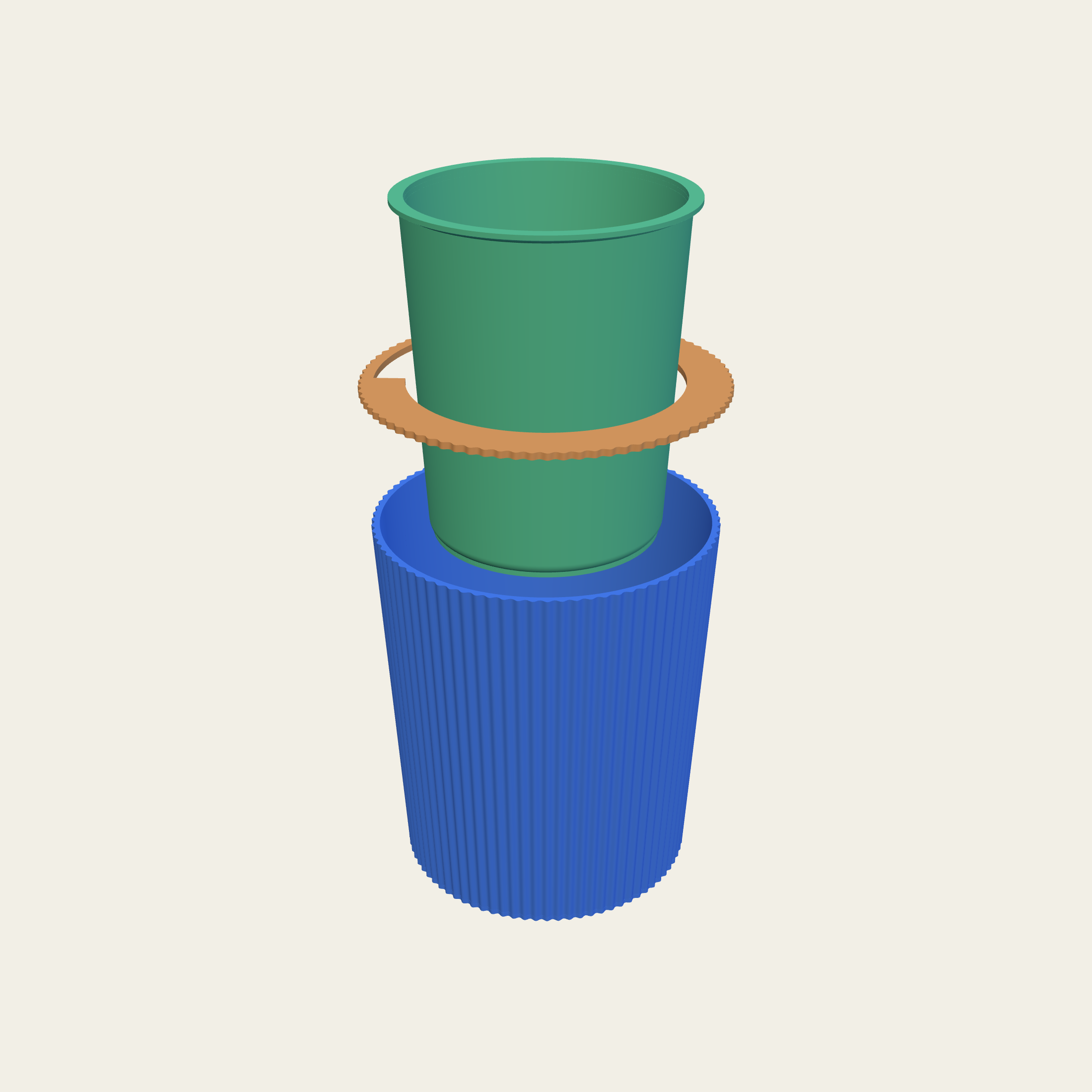 The pot lifted apart: the liner, the seat ring it hangs on, and the shell below.